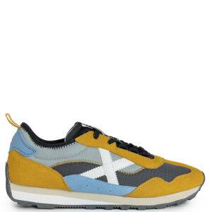 Zapatillas de la marca Munich modelo UM 64. Zapatillas deportivas elaboradas en combinación de nylon y ante. Suela de goma bicolor y cierre con cordones.